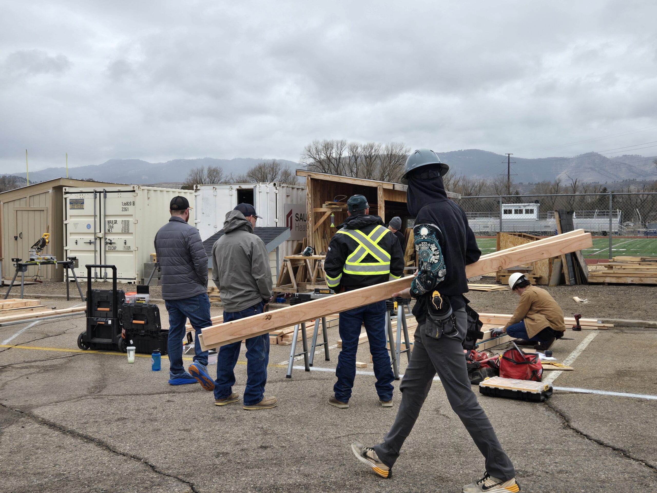Students framing walls on a job site