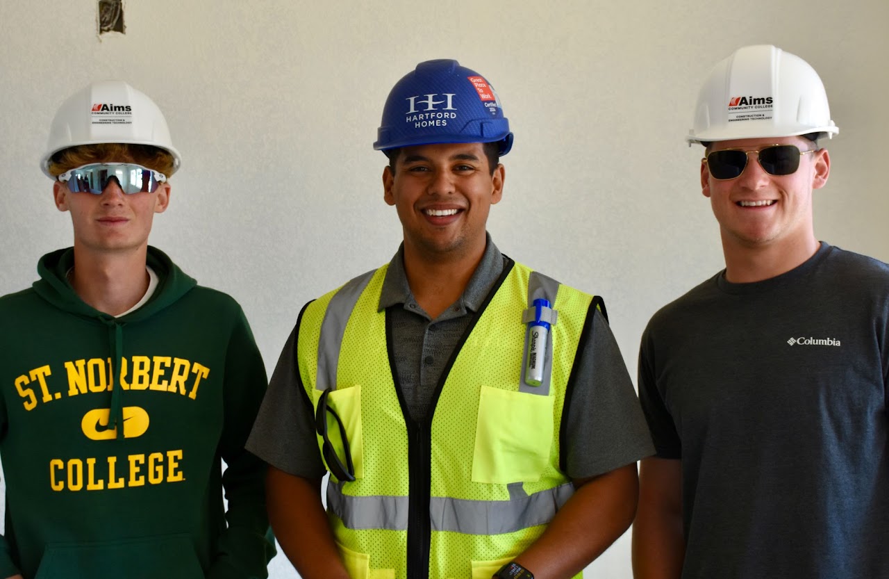 BUILT NoCO students and mentor in hard hats